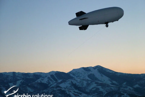 AS10 Advertising Balloon Flying over the rocky mountains